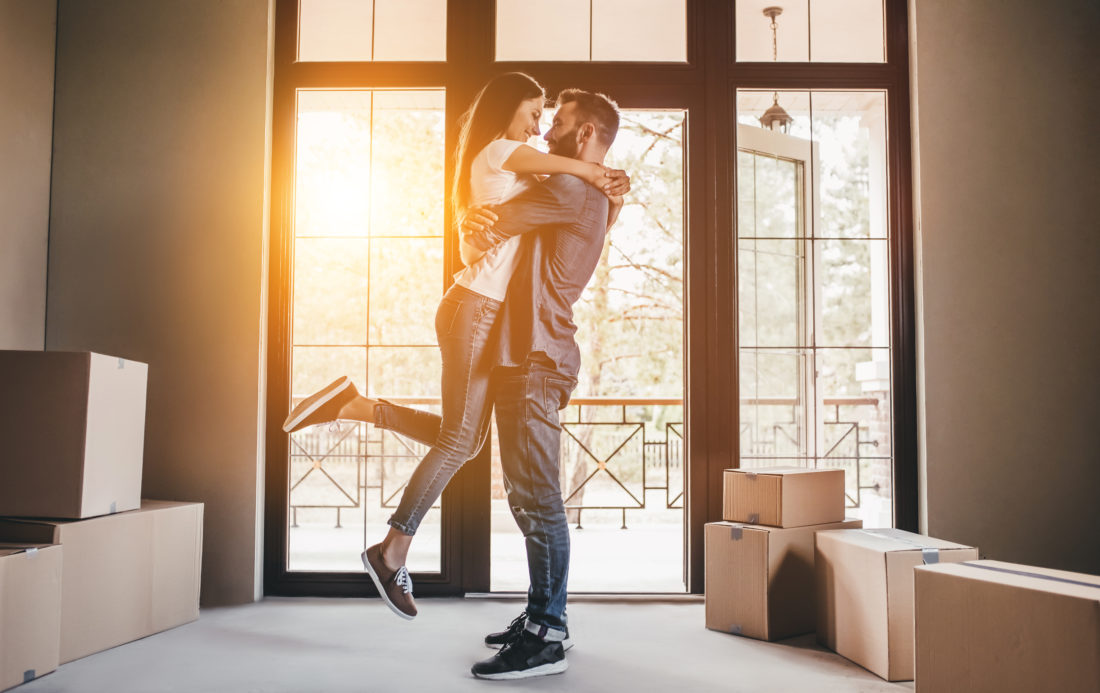 Couple happy after buying first home